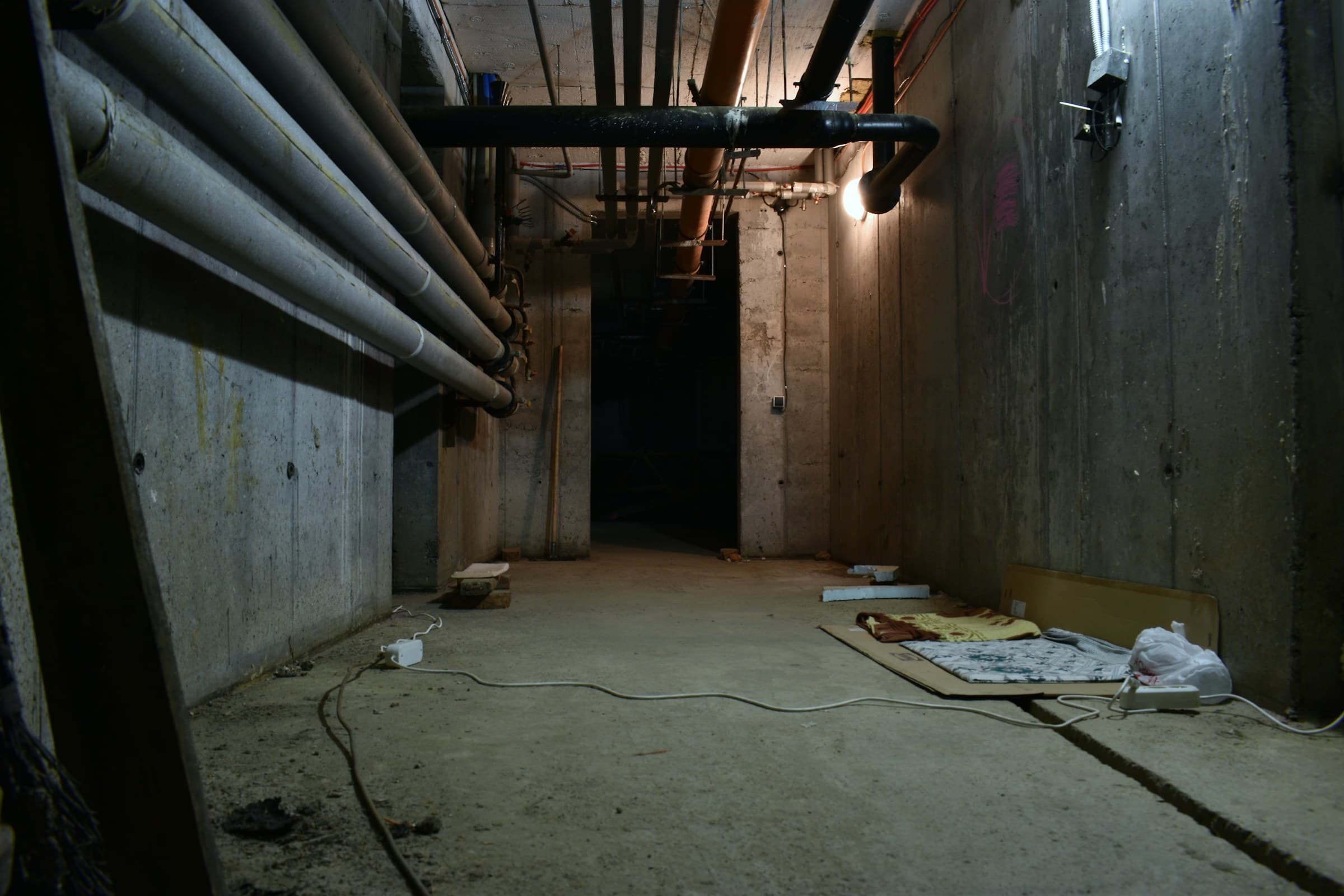 Unfinished basement with exposed pipes